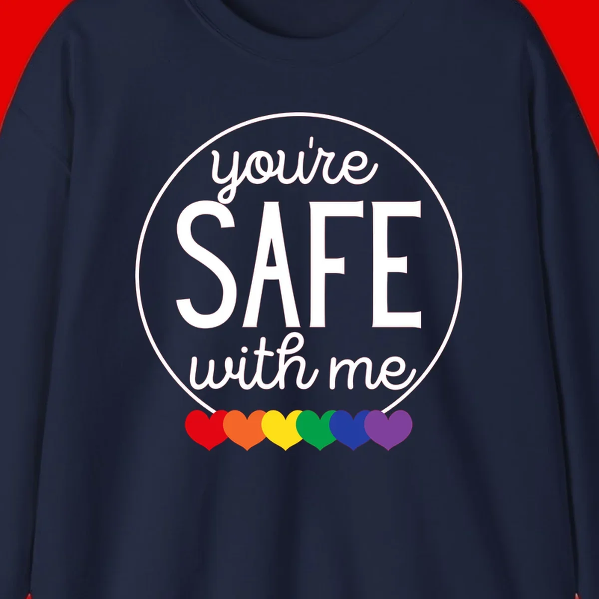 Circular badge with 'you're SAFE with me' text and rainbow pride hearts, promoting inclusive safe space message