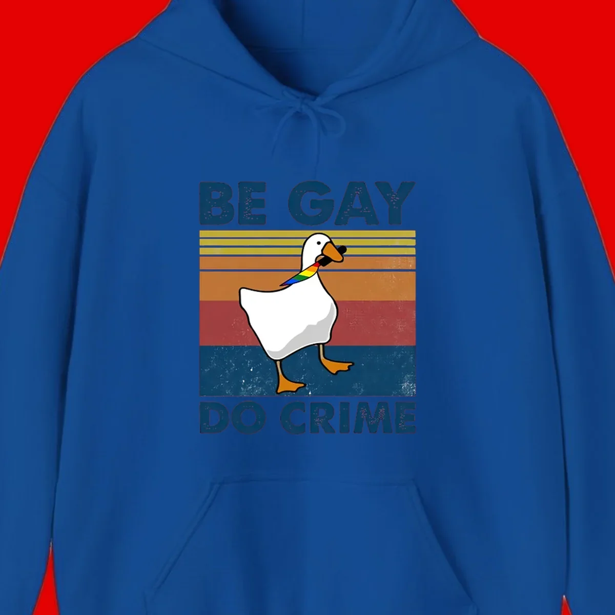 White duck with rainbow wing on retro striped background with 'Be Gay Do Crime' text, pride design