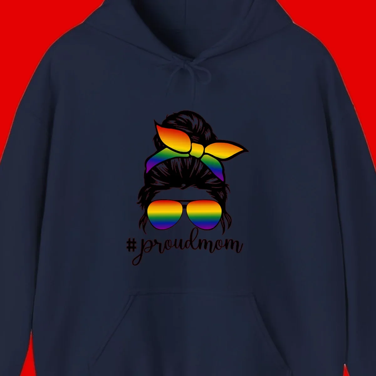 Illustration of a woman with black hair wearing rainbow bow, sunglasses, and lips with #proudmom text celebrating LGBTQ pride