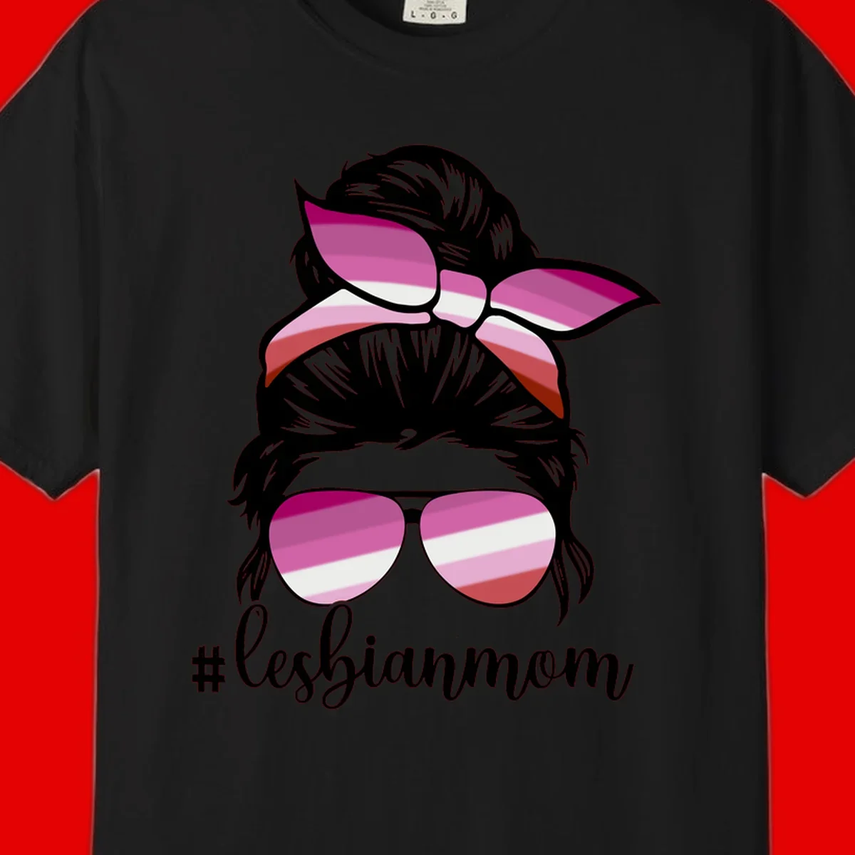 Illustration of a woman with black hair, pink bow, and aviator sunglasses featuring lesbian pride flag stripes with #lesbianmom text