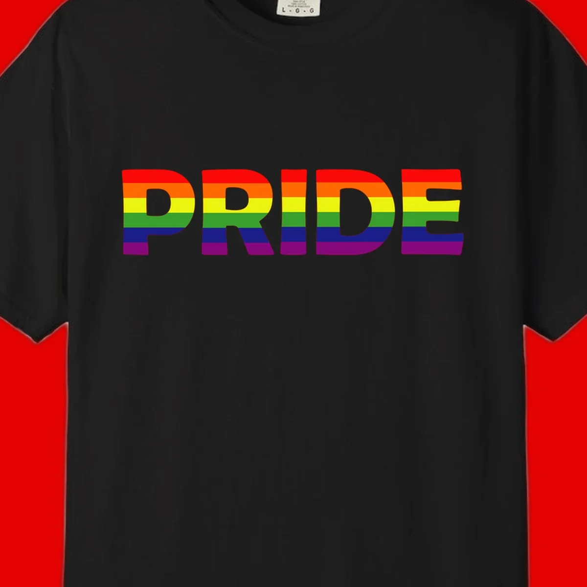 The word PRIDE in large letters filled with rainbow pride flag stripes on gray background