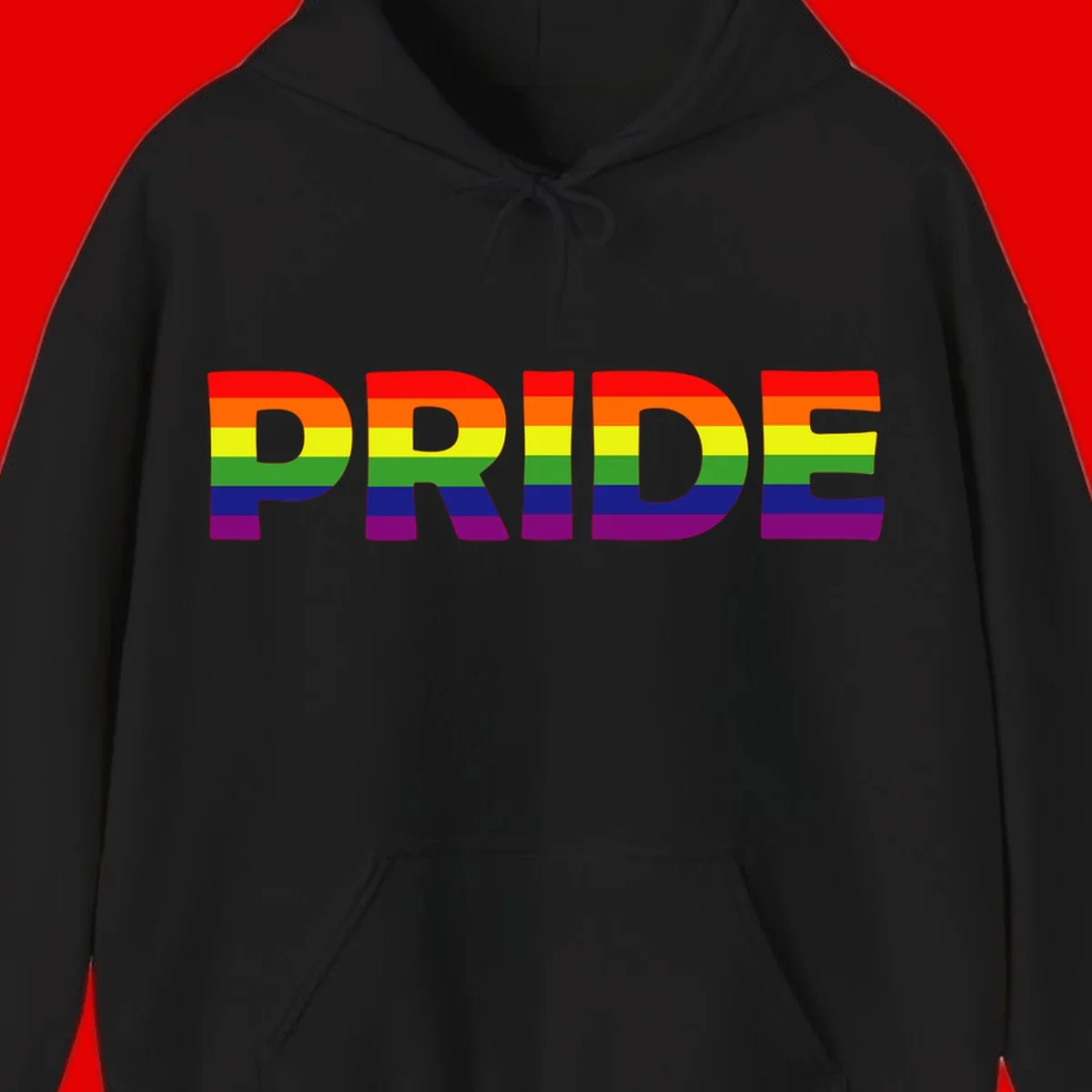 The word PRIDE in large letters filled with rainbow pride flag stripes on gray background