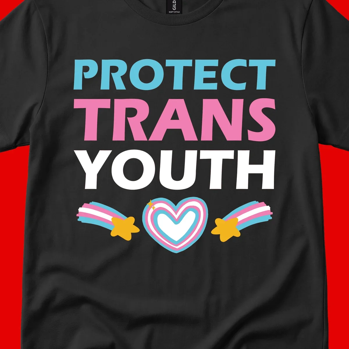 Protect trans youth design with cyan, pink, and white text, rainbow heart, and gold stars on gray background