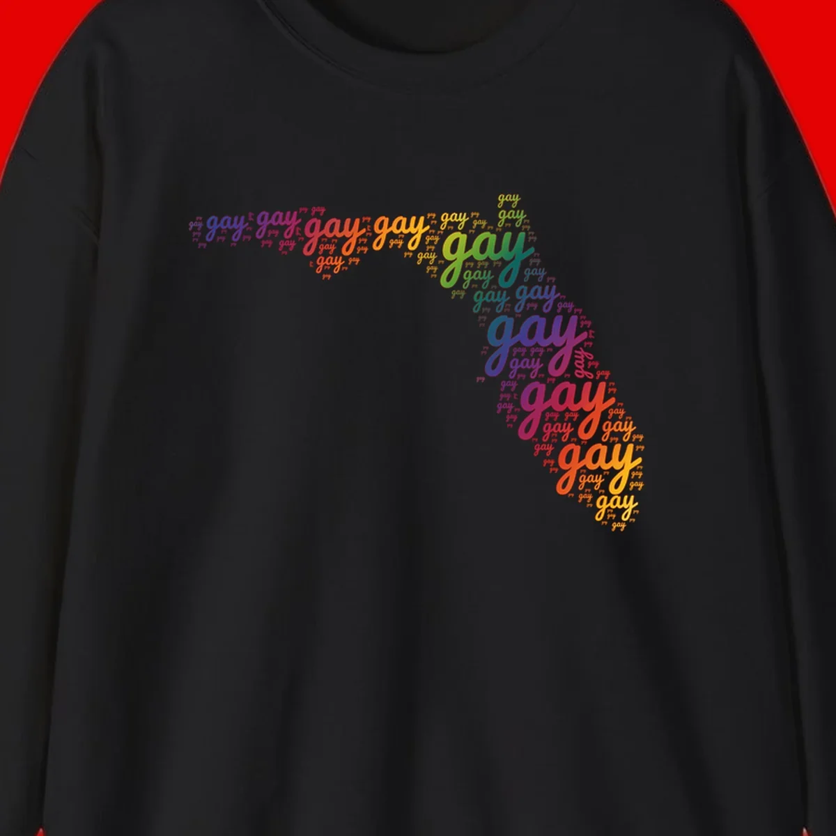 Gay pride word cloud with 'gay' repeated in rainbow colors including blue, purple, red, orange, yellow, and green on gray background