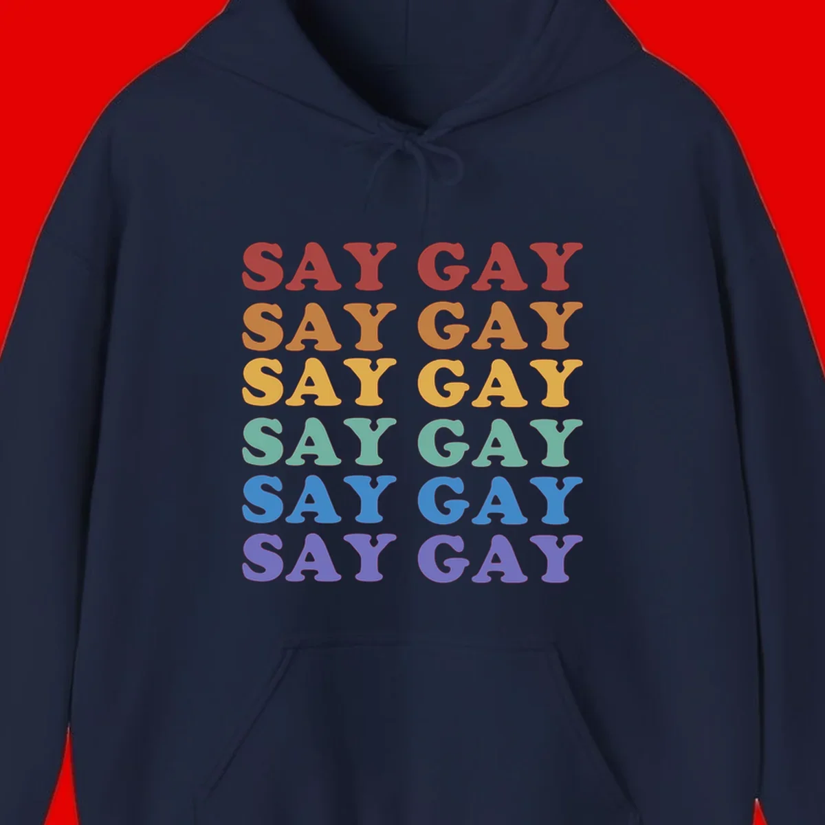 Repeating 'SAY GAY' text in rainbow colors from red to purple on gray background, pride statement design