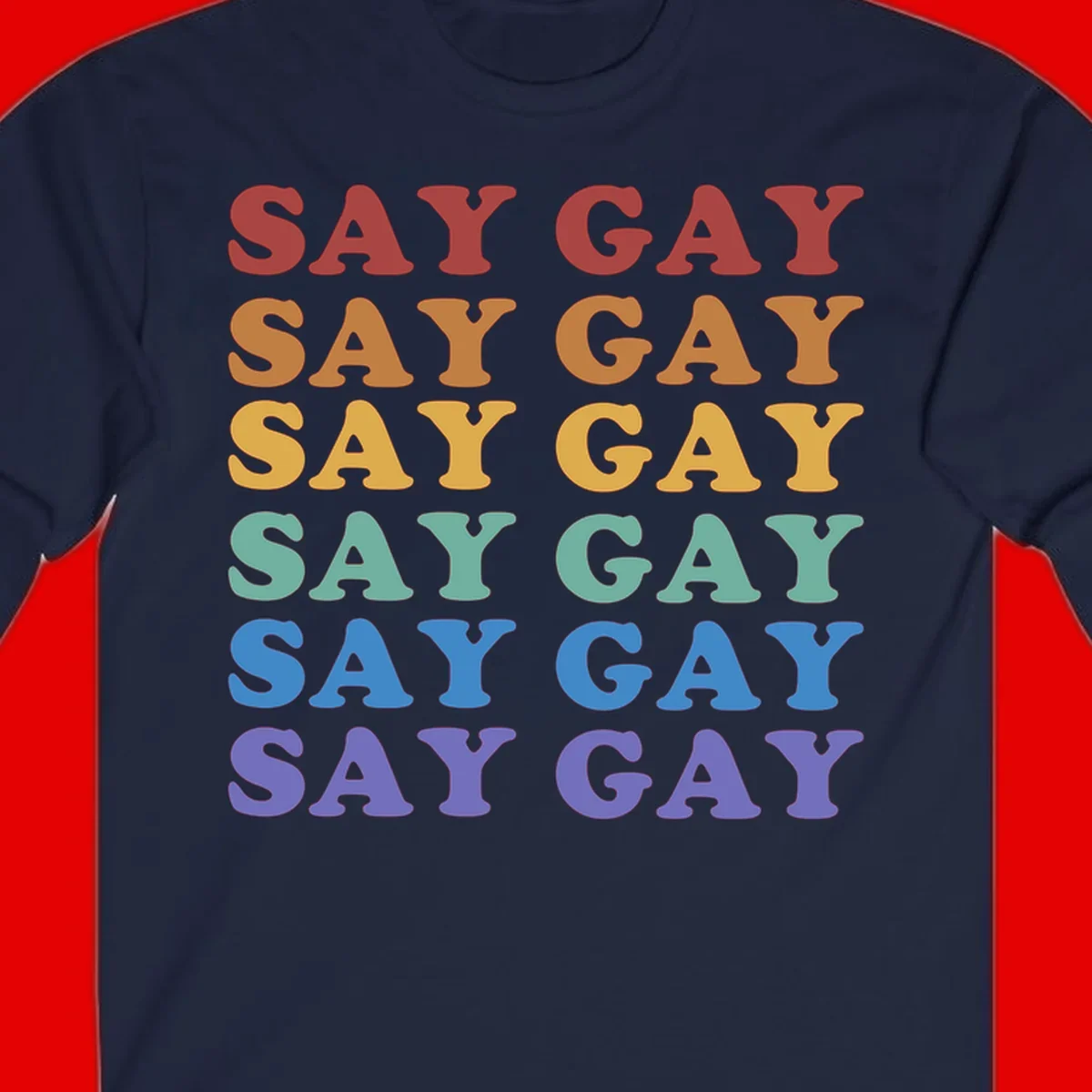 Repeating 'SAY GAY' text in rainbow colors from red to purple on gray background, pride statement design