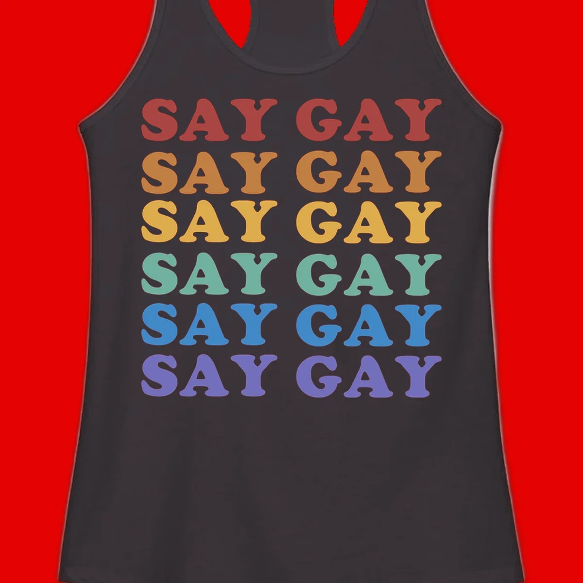 Repeating 'SAY GAY' text in rainbow colors from red to purple on gray background, pride statement design