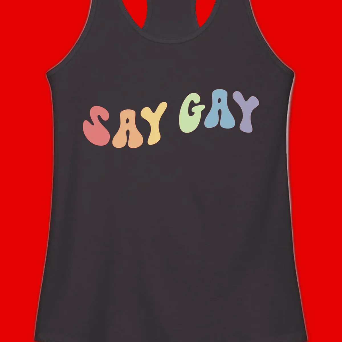 Colorful bubble letters spelling SAY GAY in rainbow pride colors: red, peach, yellow, green, blue, and purple on gray background
