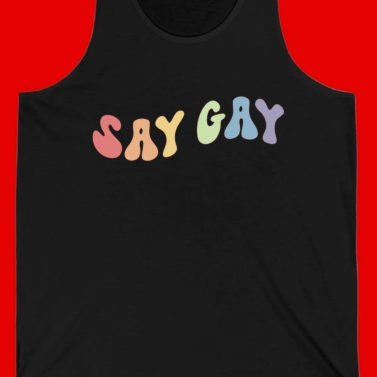 Colorful bubble letters spelling SAY GAY in rainbow pride colors: red, peach, yellow, green, blue, and purple on gray background