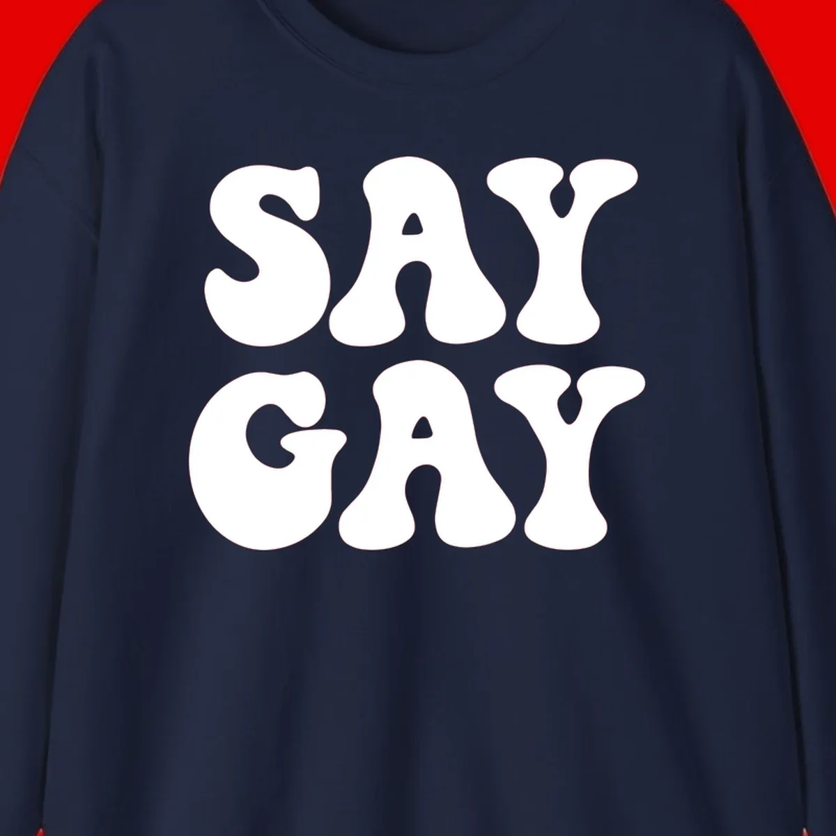 Say Gay Pride design with bold white letters featuring organic rounded typography on gray background