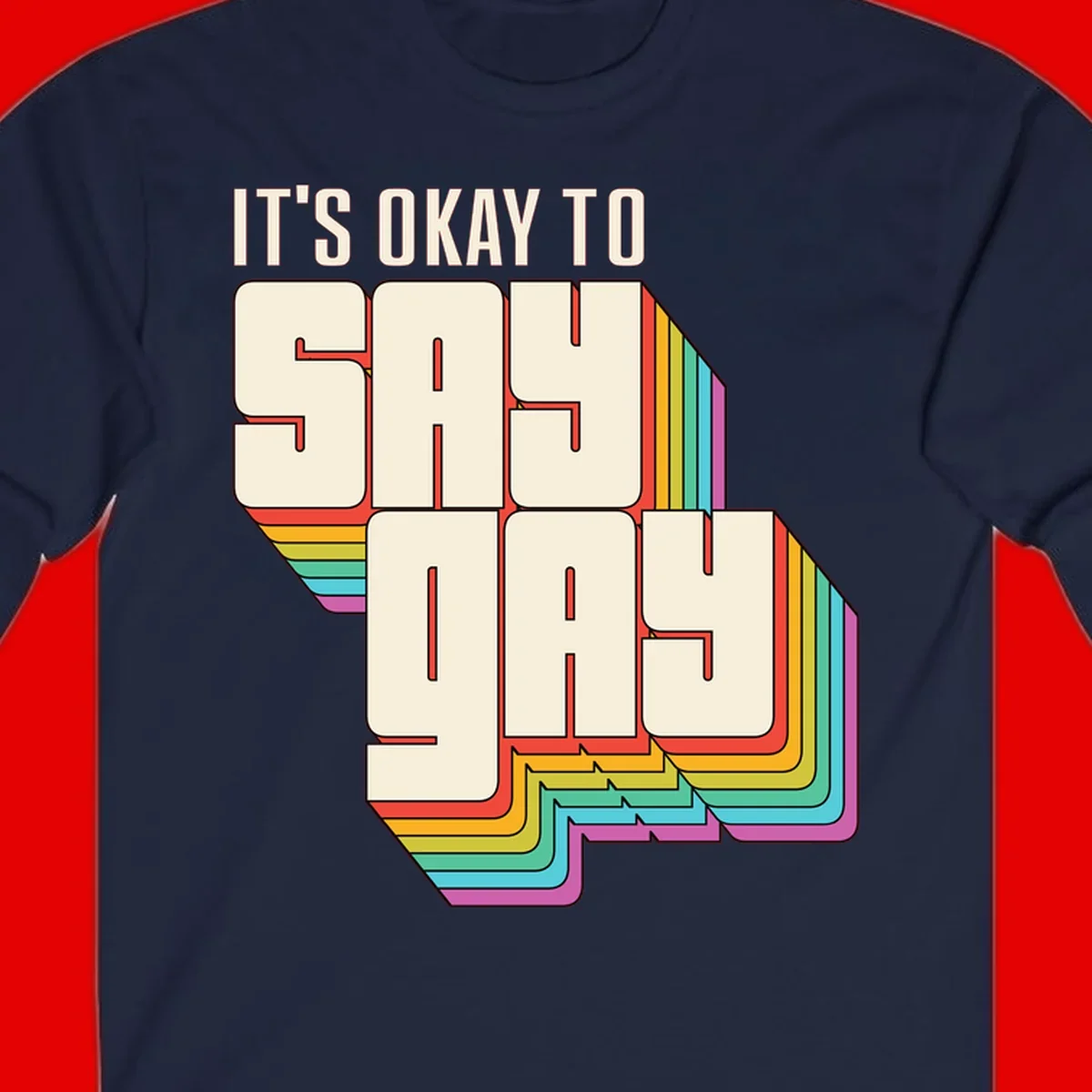 3D block letter design reading 'It's Okay To Sigh Out Loud' with rainbow-colored layered borders and pride flag stripes