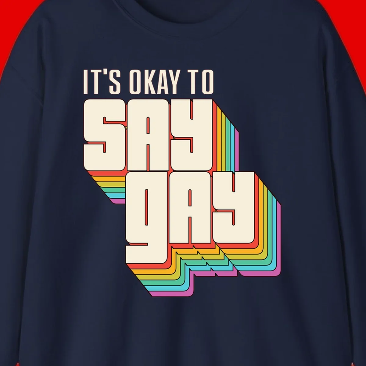 3D block letter design reading 'It's Okay To Sigh Out Loud' with rainbow-colored layered borders and pride flag stripes