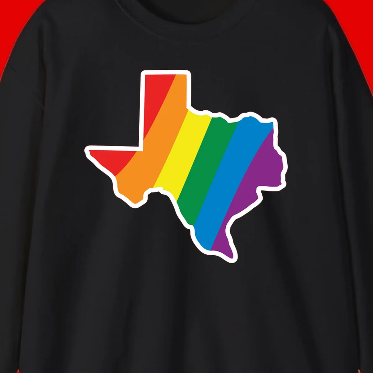 Texas state map filled with diagonal rainbow pride flag stripes in red, orange, yellow, green, blue, and purple with white border