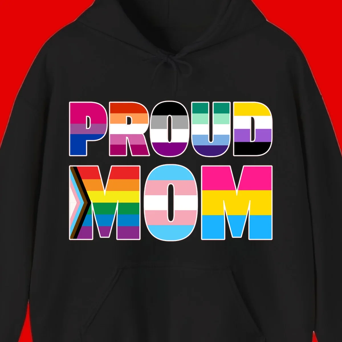 Colorful 'PROUD' letters filled with various pride flags including rainbow, trans, progress pride, and intersex symbols on gray background