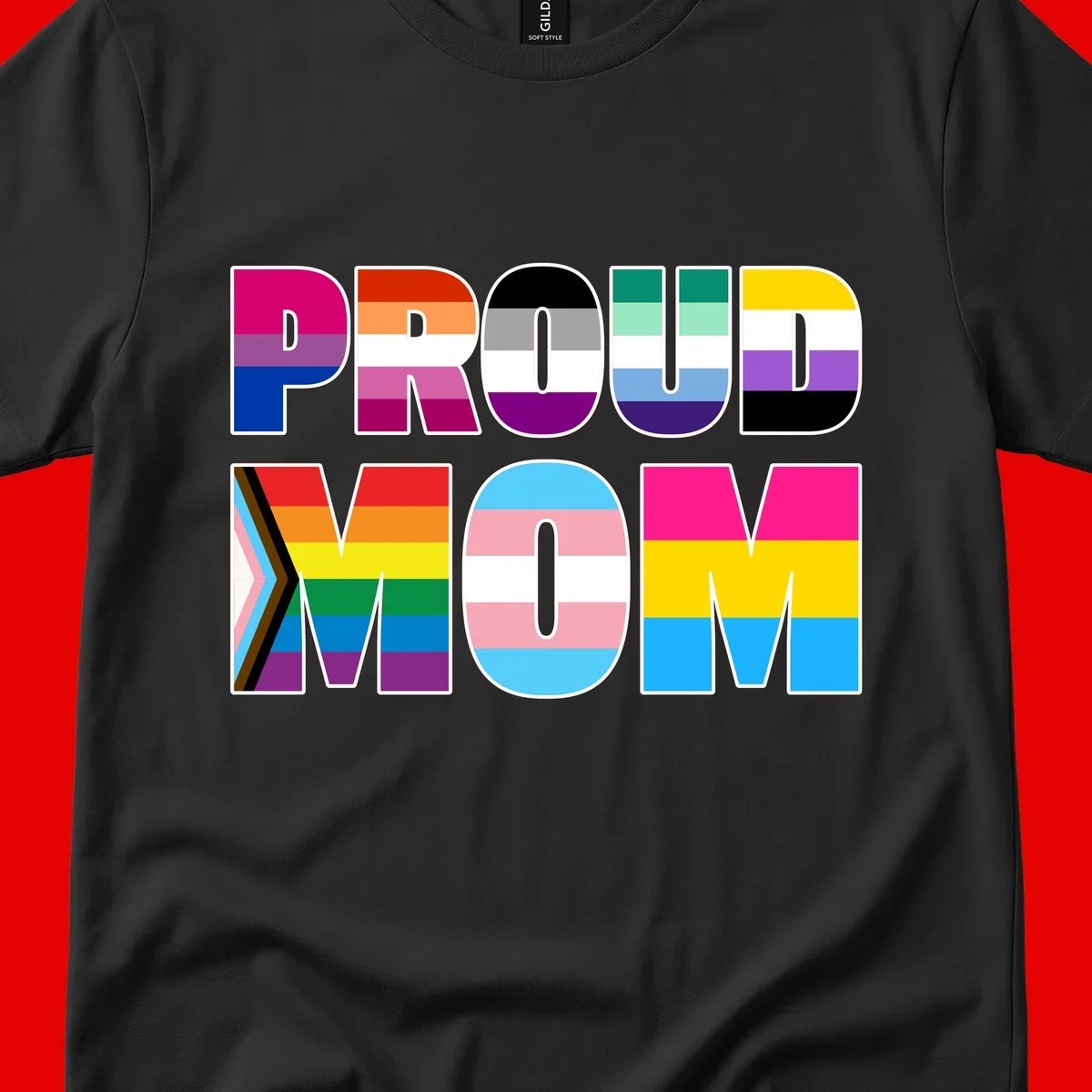 Colorful 'PROUD' letters filled with various pride flags including rainbow, trans, progress pride, and intersex symbols on gray background