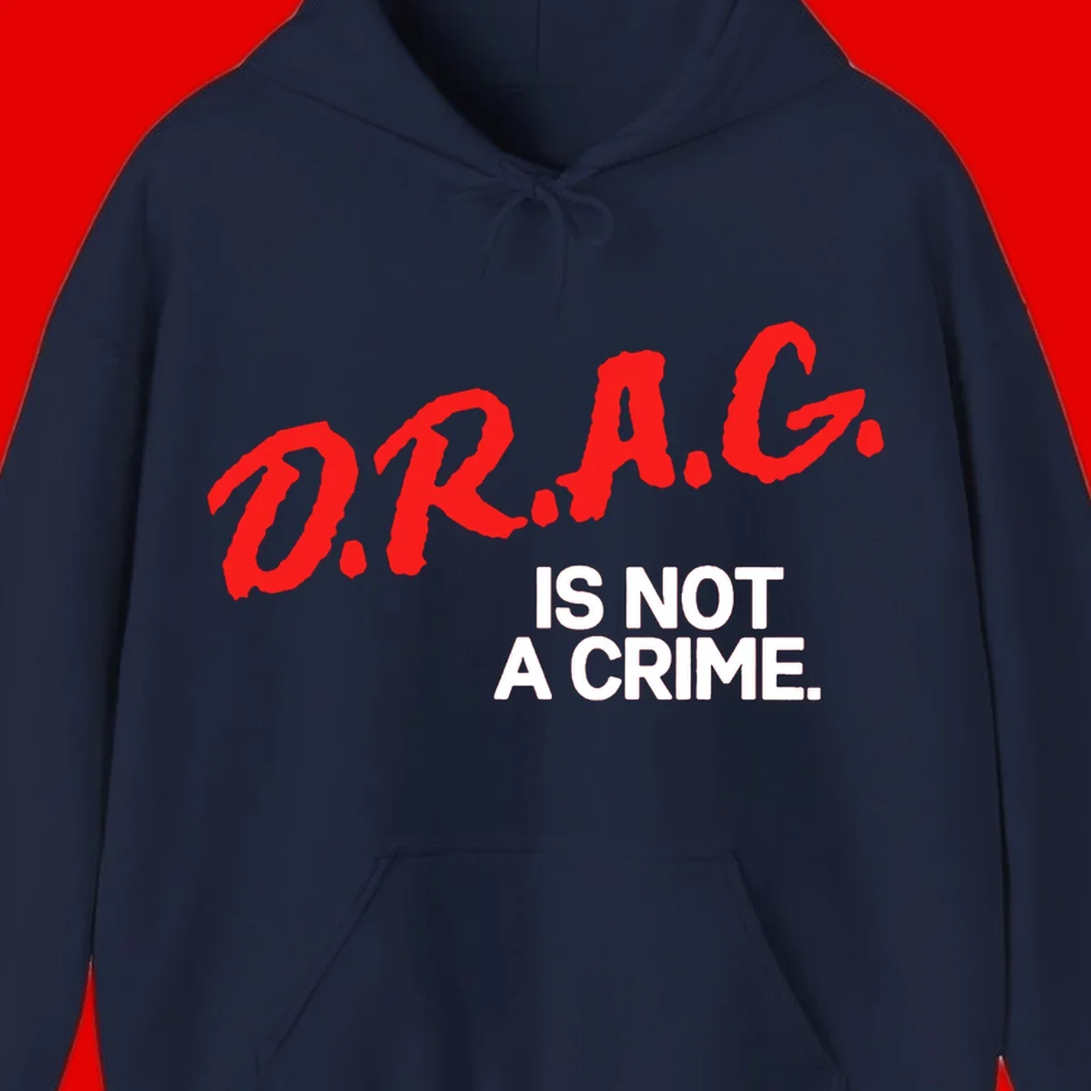 Red hand-drawn lettering spelling 'D.R.A.G.' with white text reading 'IS NOT A CRIME' on gray background