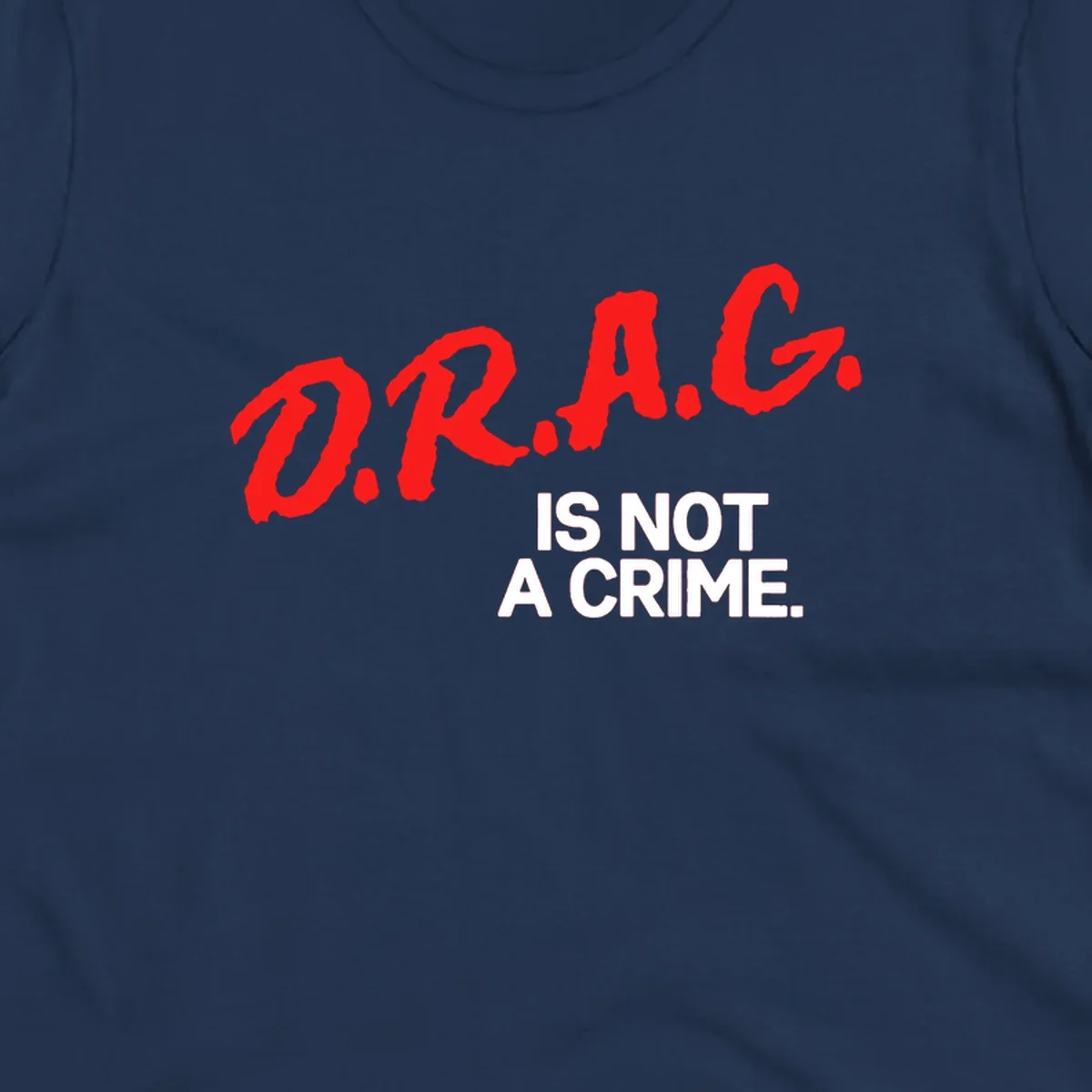 Red hand-drawn lettering spelling 'D.R.A.G.' with white text reading 'IS NOT A CRIME' on gray background