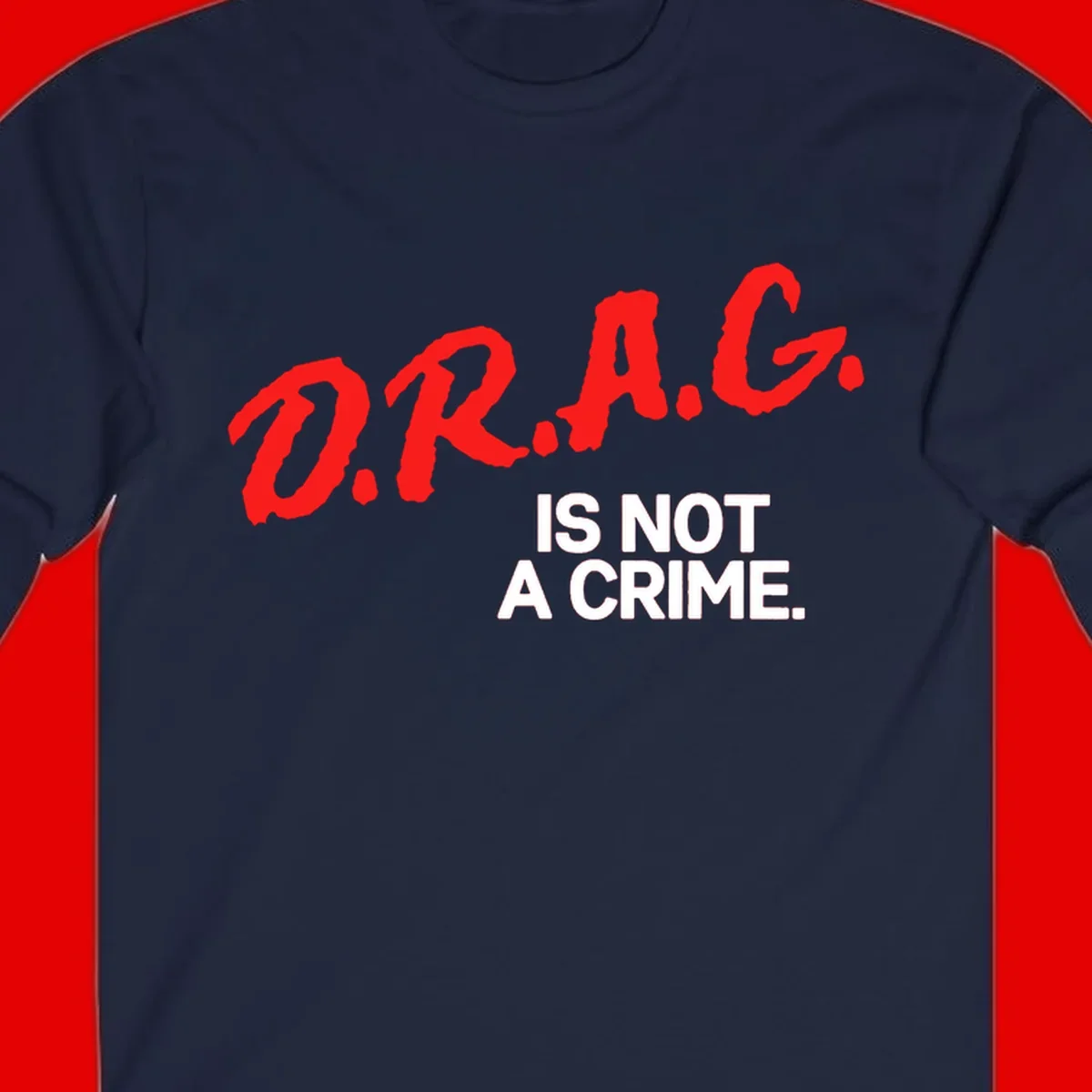 Red hand-drawn lettering spelling 'D.R.A.G.' with white text reading 'IS NOT A CRIME' on gray background