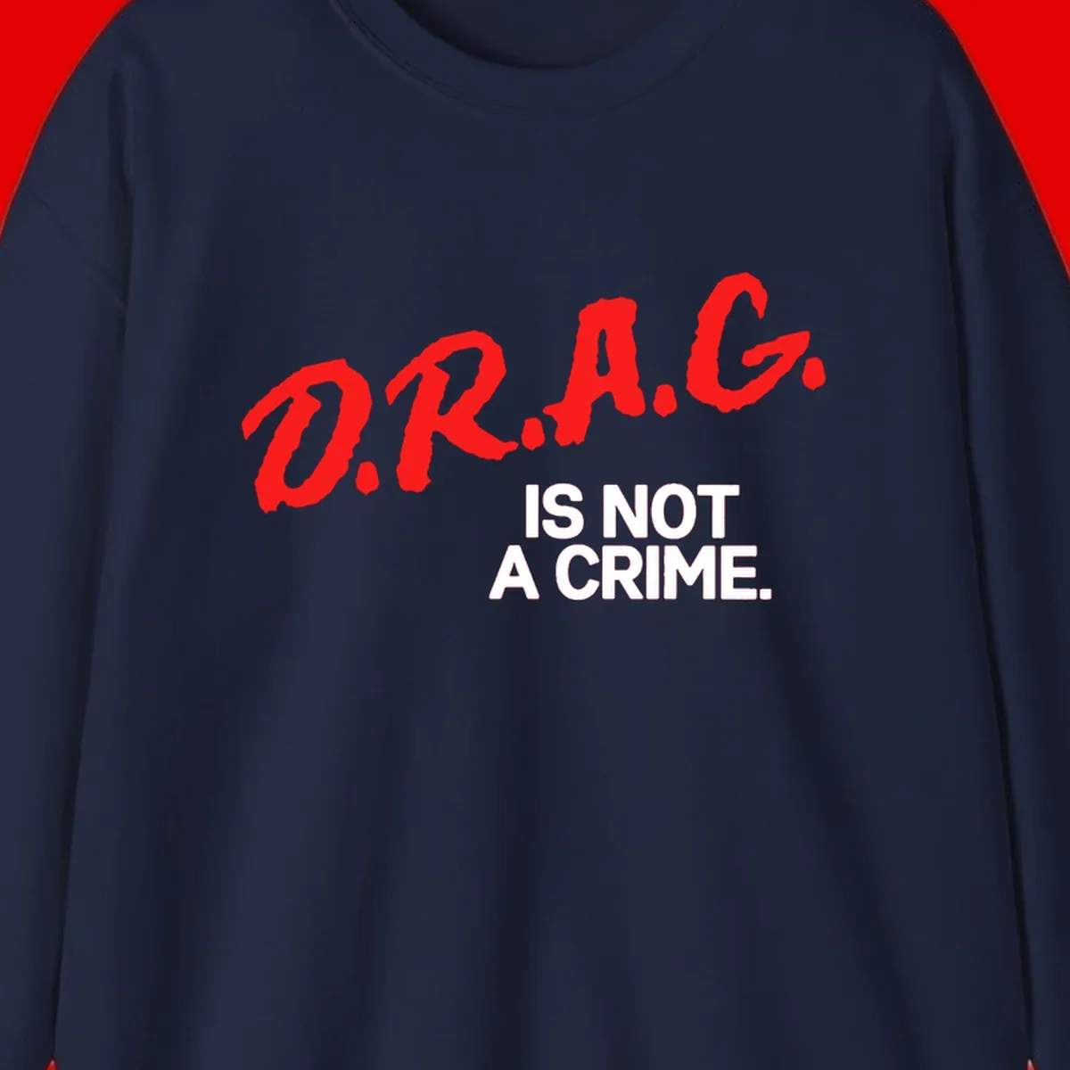 Red hand-drawn lettering spelling 'D.R.A.G.' with white text reading 'IS NOT A CRIME' on gray background