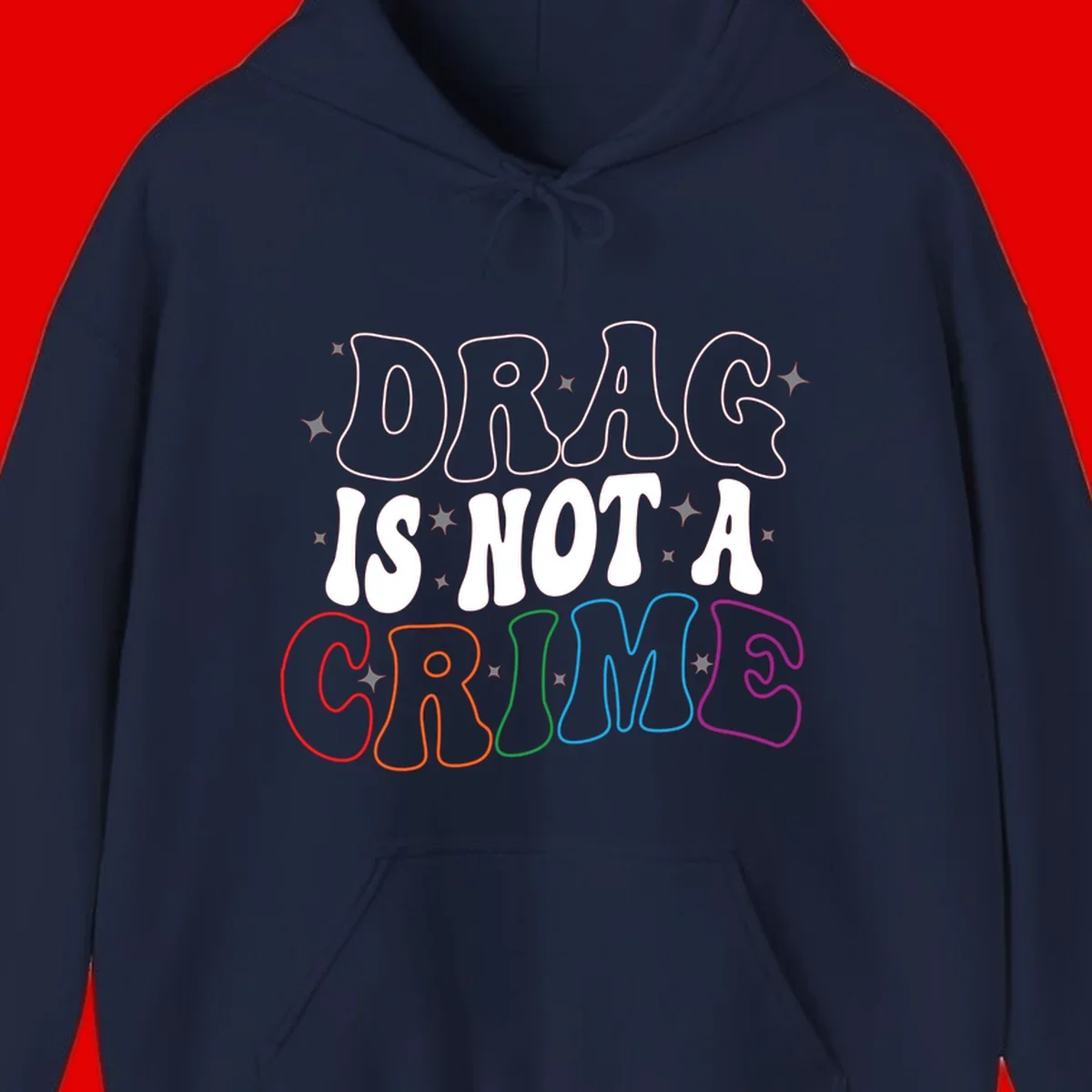 Drag is not a crime design with white and rainbow-colored outlined text on gray background