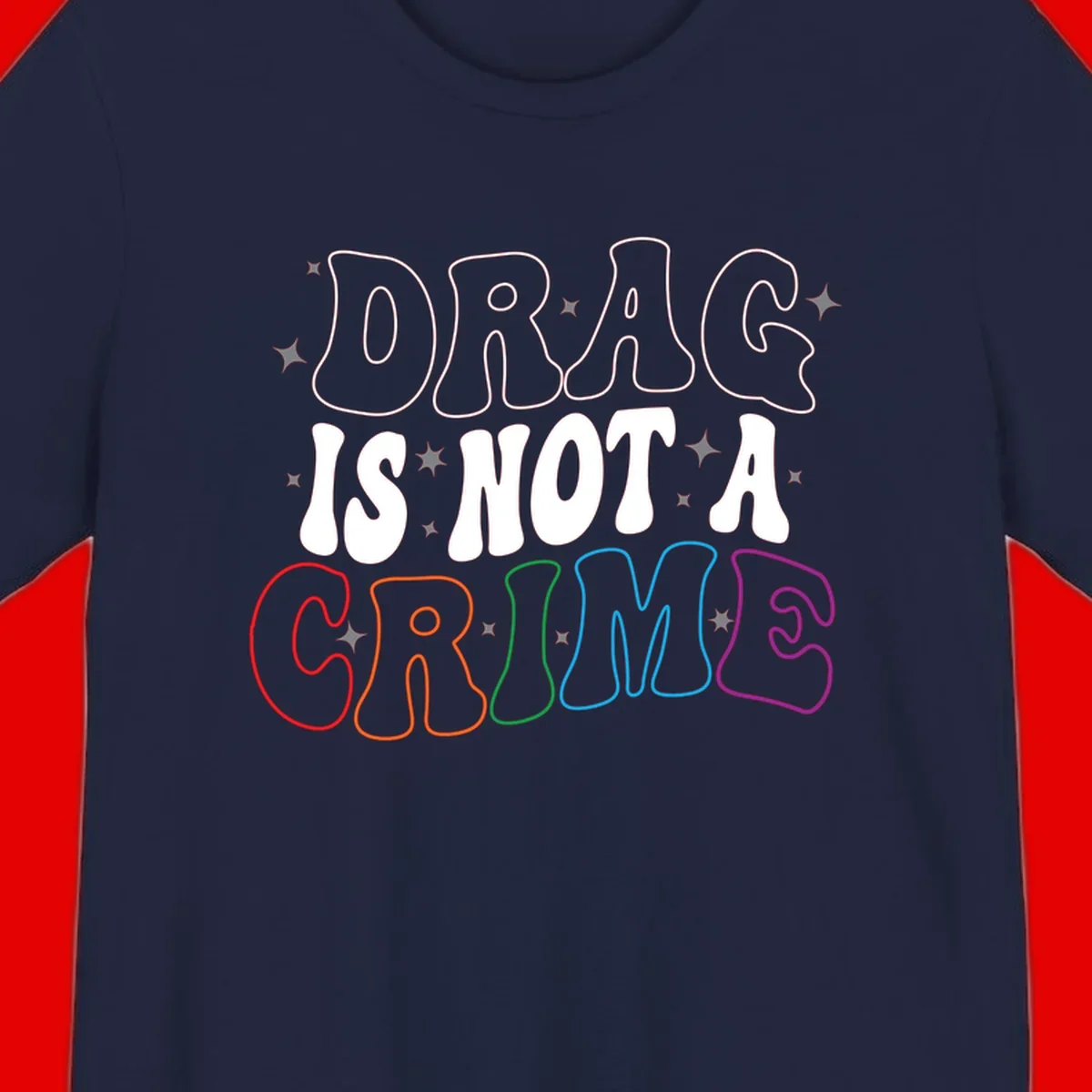 Drag is not a crime design with white and rainbow-colored outlined text on gray background