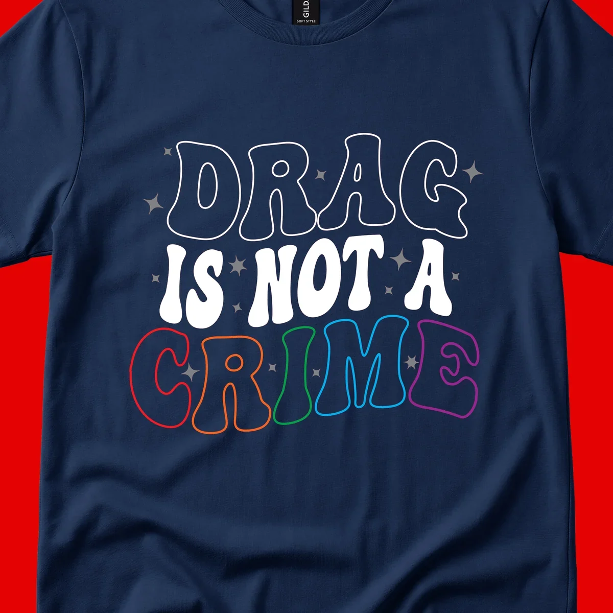 Drag is not a crime design with white and rainbow-colored outlined text on gray background