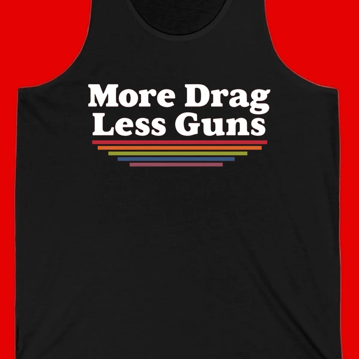 More Drag Less Guns design: white text on gray background with colored horizontal bars representing pride and activism