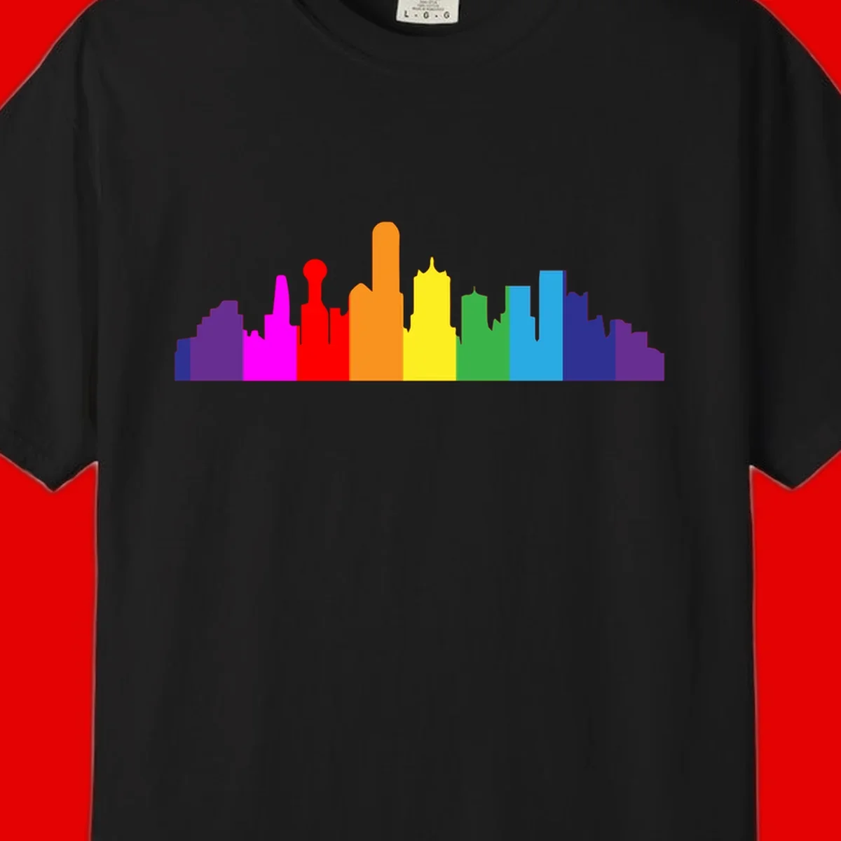 Colorful city skyline silhouette in rainbow pride colors transitioning from purple through red, orange, yellow, green, cyan and blue