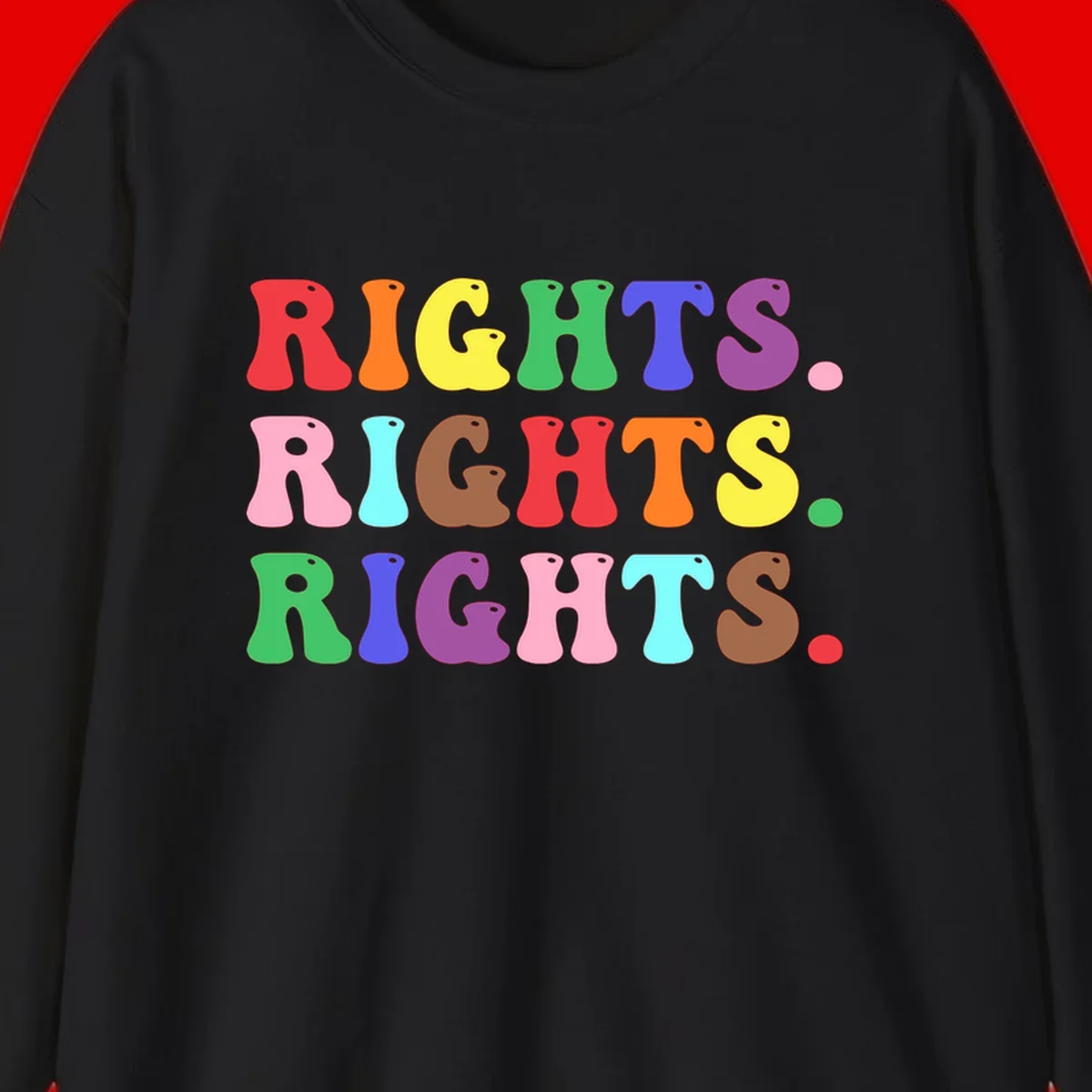 The word 'RIGHTS' repeated three times in large rainbow-colored letters with playful organic shapes and small dots, celebrating pride and equality.