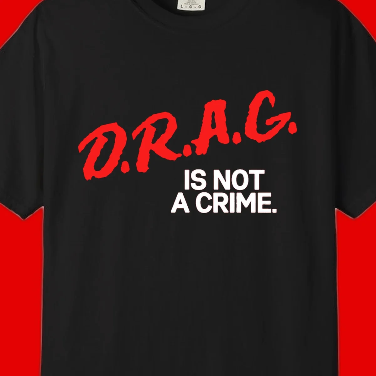 Bold red LGBTQ+ letters with white text reading 'IS NOT A CRIME' on gray background, pride statement design.