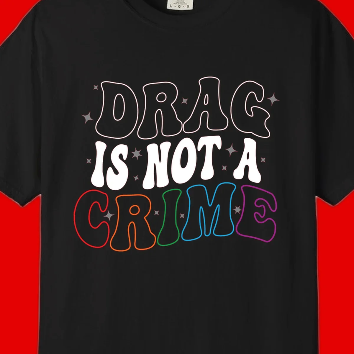 Drug is not a crime design with rainbow pride colored letters on gray background, promoting social justice and harm reduction advocacy