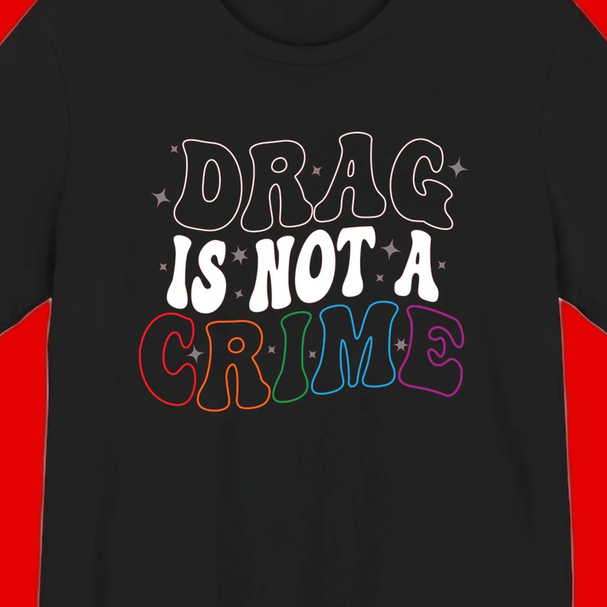 Drug is not a crime design with rainbow pride colored letters on gray background, promoting social justice and harm reduction advocacy