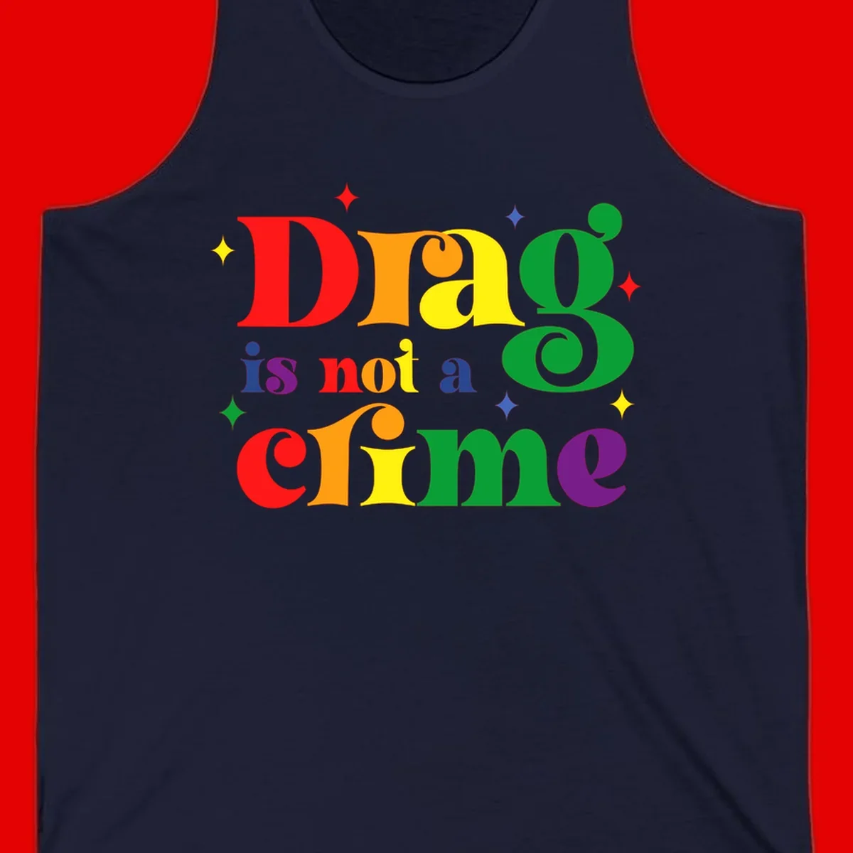 Rainbow gradient text reading 'Drag is not a crime' with colorful stars on gray background