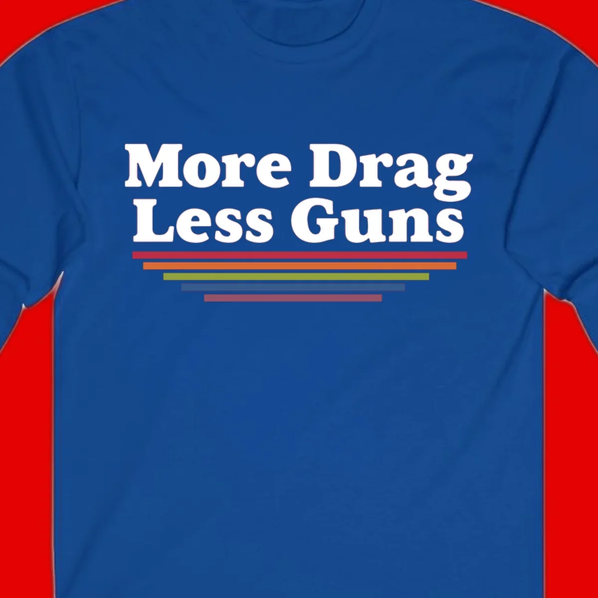Bold white text reading 'More Drag Less Guns' with colorful horizontal bars below on gray background