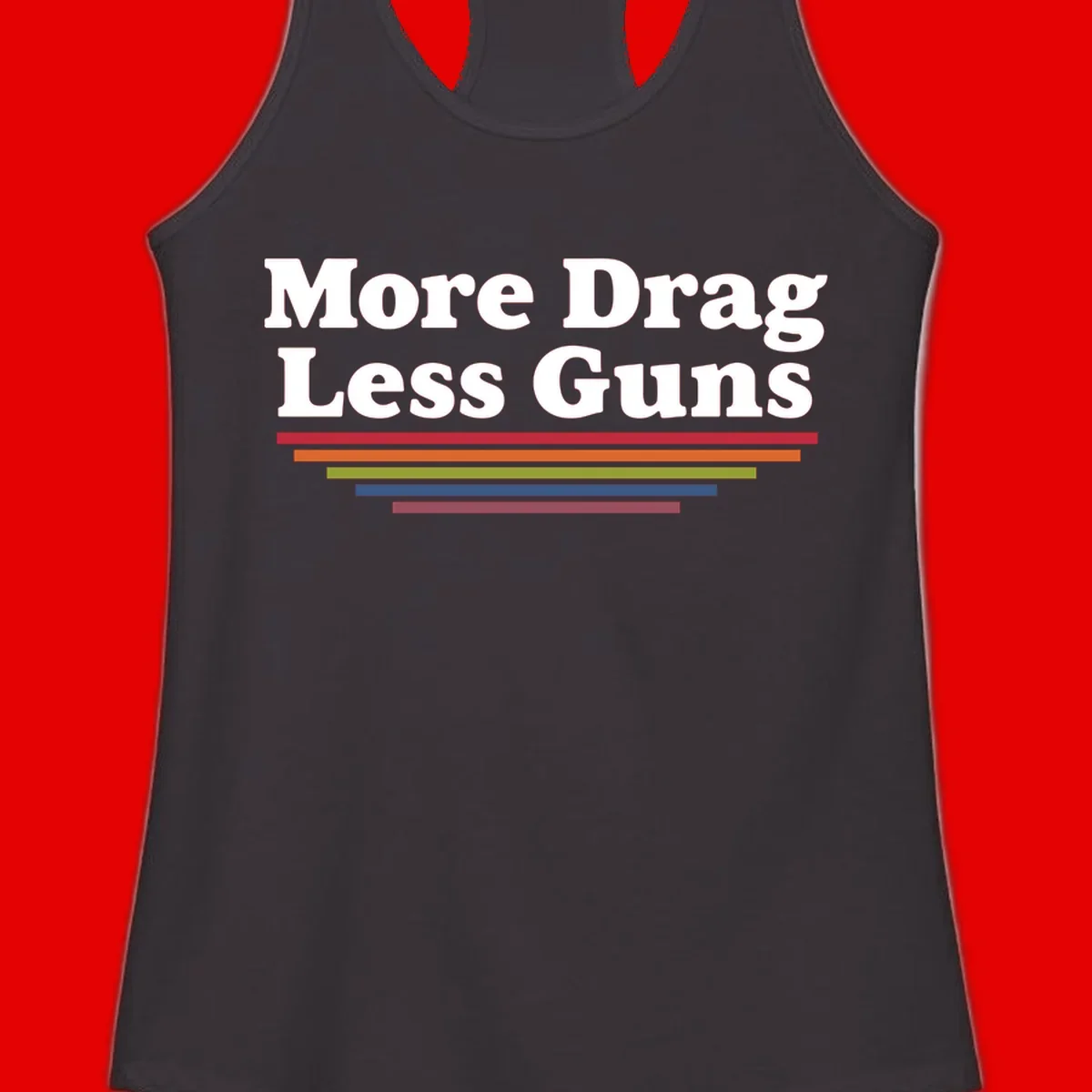 Bold white text reading 'More Drag Less Guns' with colorful horizontal bars below on gray background