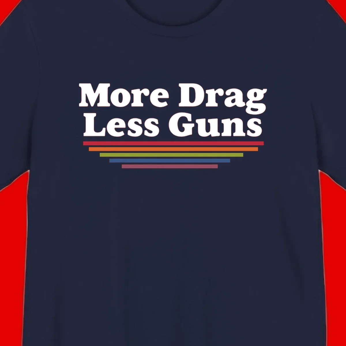 Bold white text reading 'More Drag Less Guns' with colorful horizontal bars below on gray background