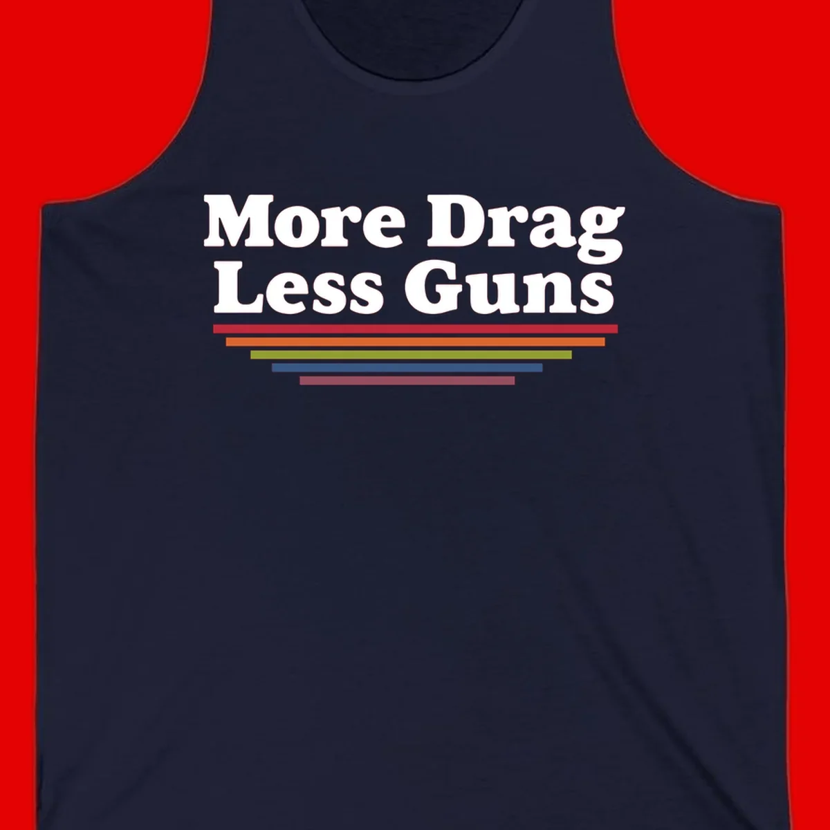 Bold white text reading 'More Drag Less Guns' with colorful horizontal bars below on gray background