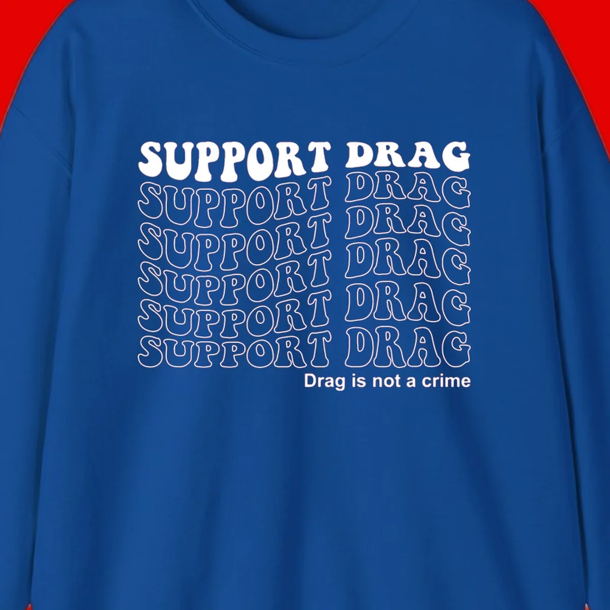 Gray shirt design with white text reading 'Support Drag' repeated vertically and 'Drag is not a crime' at bottom