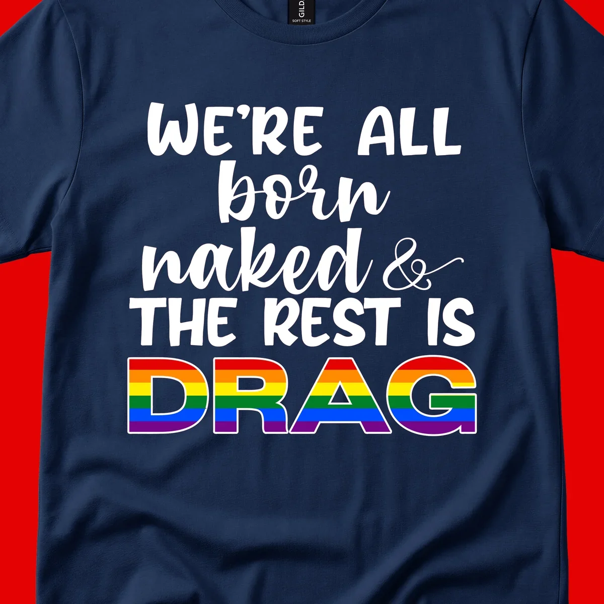Born naked rest is drag pride design with rainbow flag colored DRAG lettering and inspirational quote text on gray background