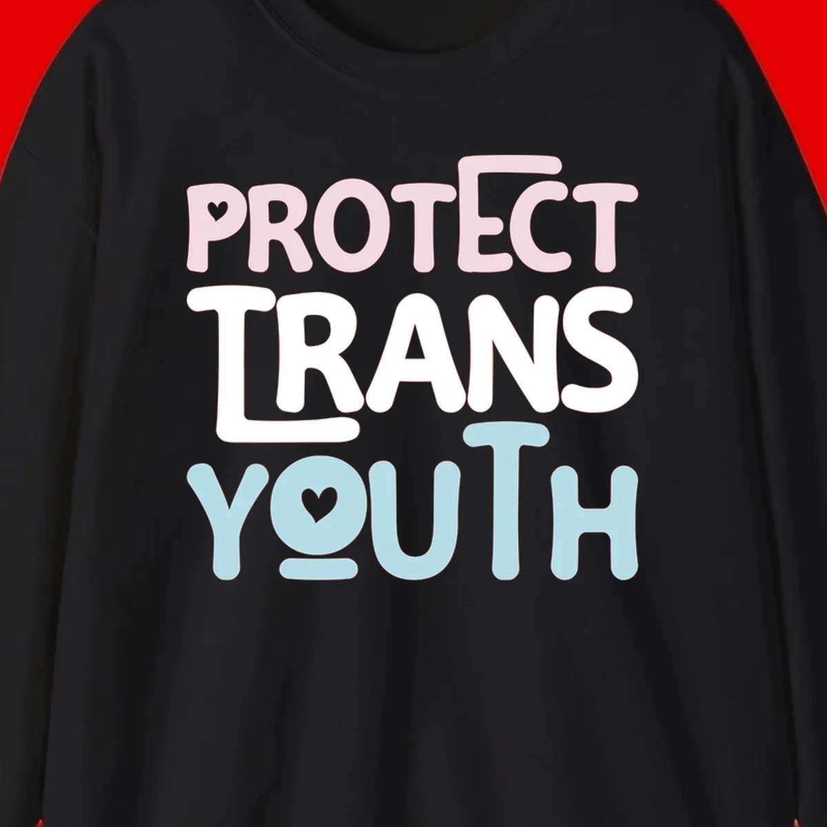 Protect trans youth design with pink, white, and blue bold lettering and heart symbols