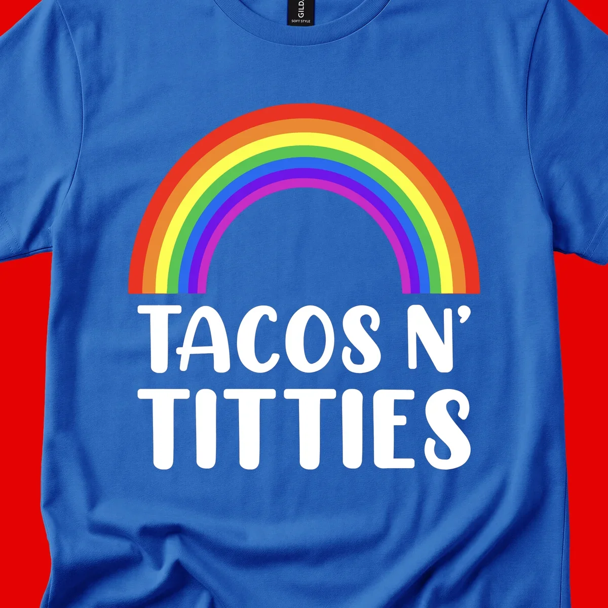 Colorful rainbow arc above white text reading 'TACOS N' TACOS' on gray background, celebrating Pride with playful design