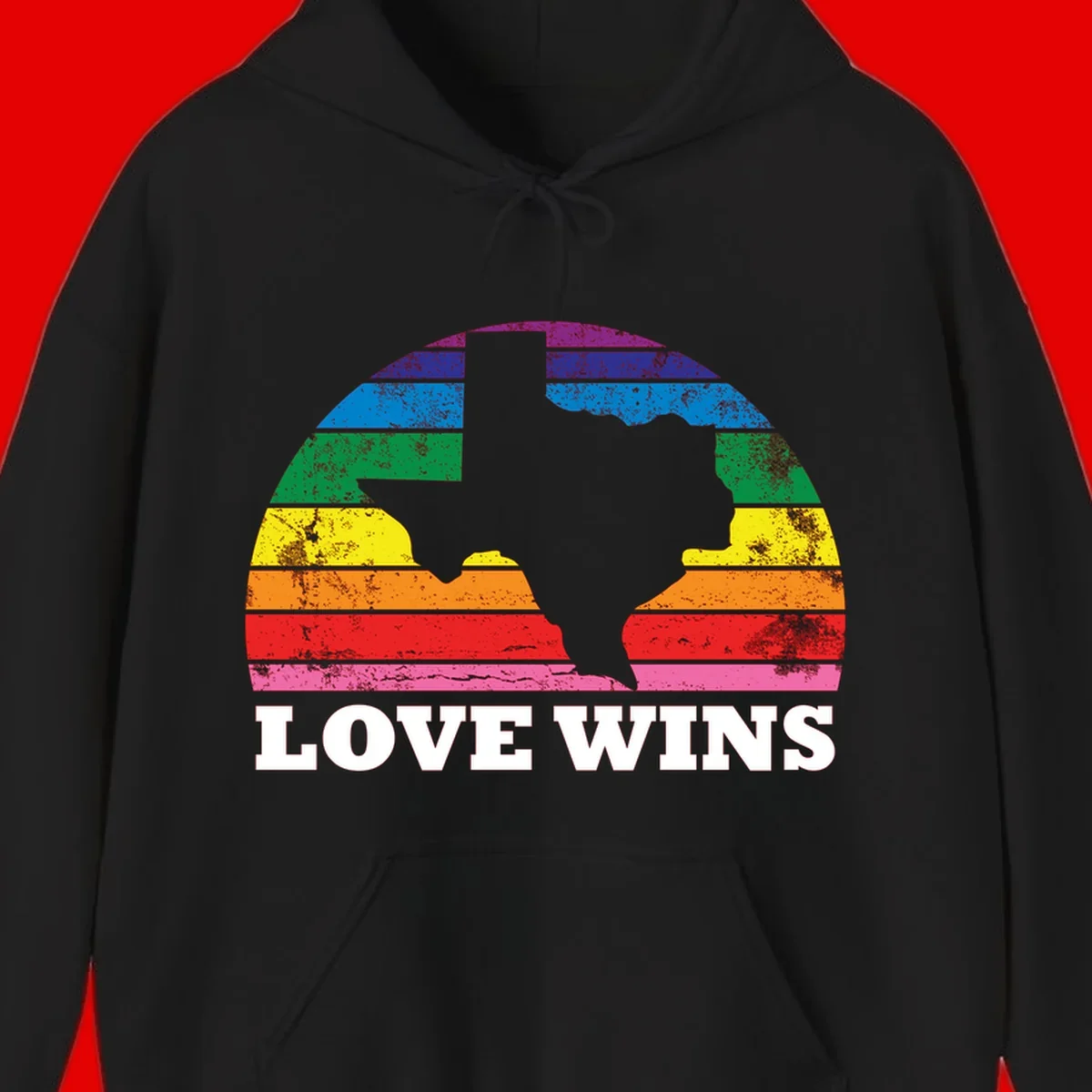 Two human head silhouettes in profile filled with rainbow horizontal stripes, with 'Love Wins' text below