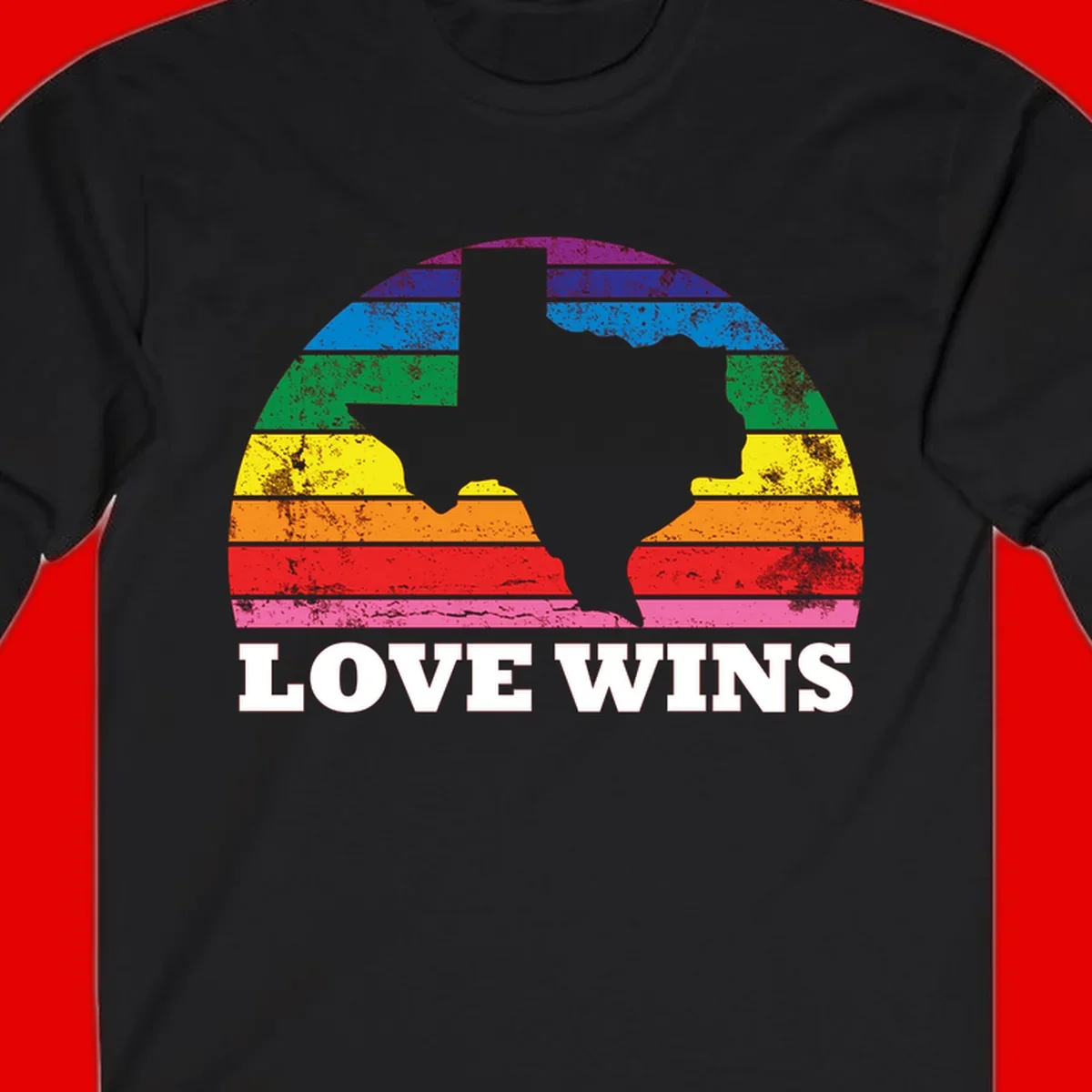 Two human head silhouettes in profile filled with rainbow horizontal stripes, with 'Love Wins' text below