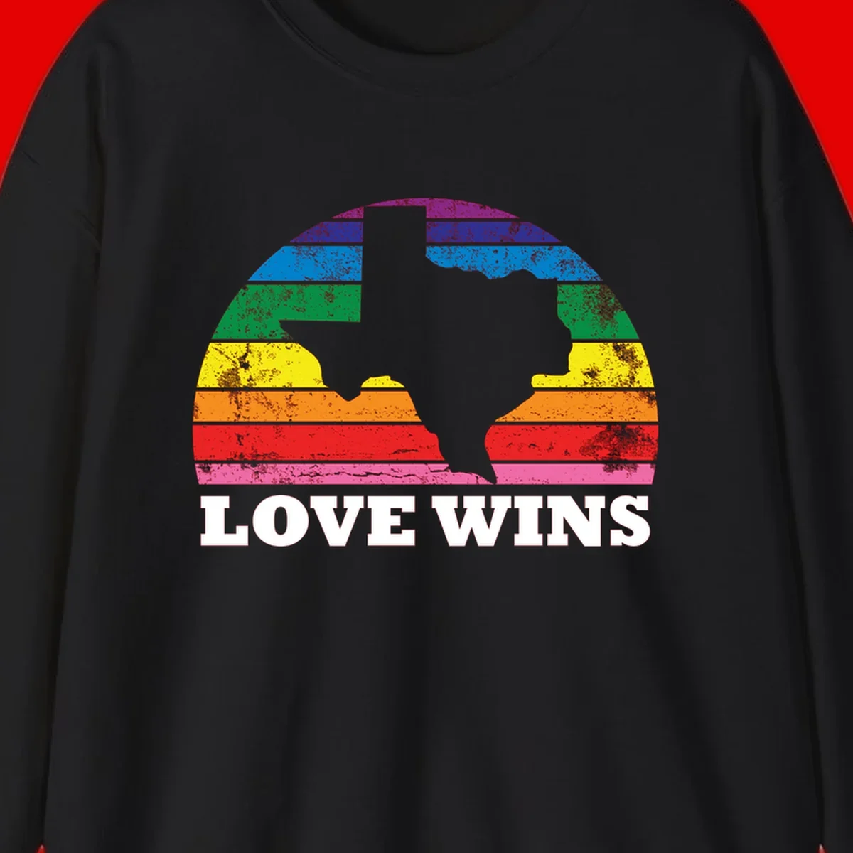 Two human head silhouettes in profile filled with rainbow horizontal stripes, with 'Love Wins' text below