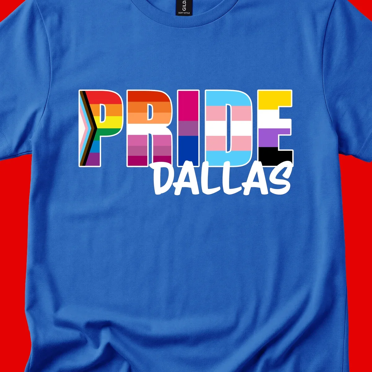 Pride Dallas design with large colorful block letters filled with rainbow and pride flag colors including progress chevron stripes