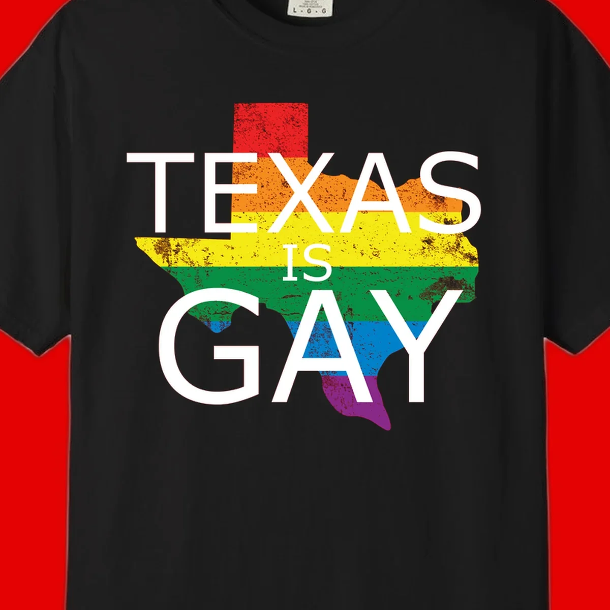 Texas state map filled with rainbow pride flag colors and white text reading 'Texas Is A Gay'