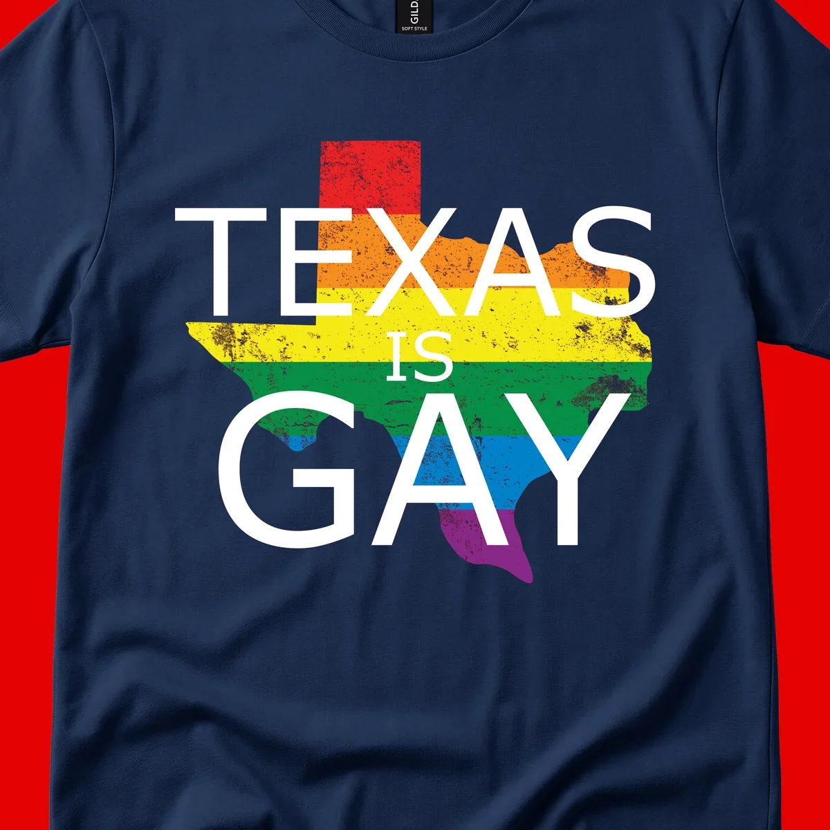 Texas state map filled with rainbow pride flag colors and white text reading 'Texas Is A Gay'