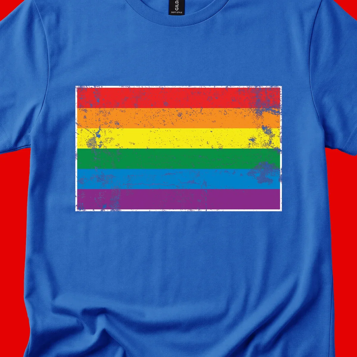 Distressed rainbow pride flag with six horizontal color stripes: red, orange, yellow, green, blue, and purple with grunge texture