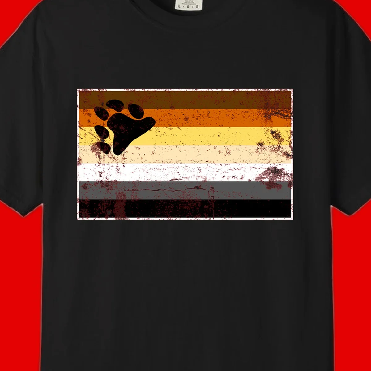 Black bear paw print on distressed horizontal striped pride flag in brown, orange, yellow, tan, white, gray and black colors