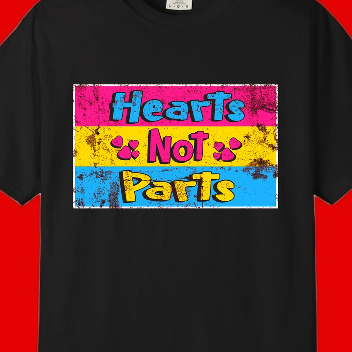 Hearts Not Parts design: magenta, yellow, and blue color-blocked graphic with distressed typography and pink hearts celebrating trans and non-binary identity
